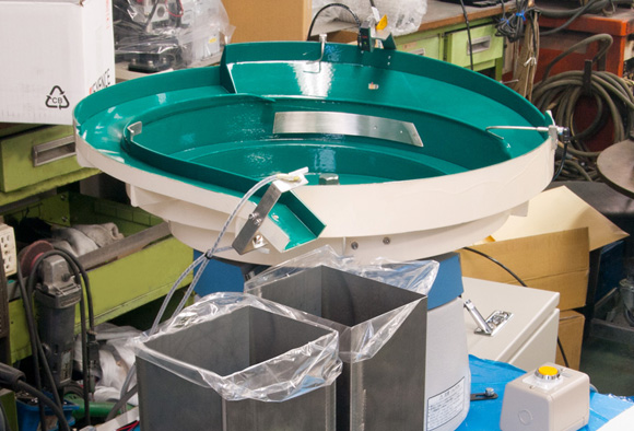 蓋付きケース整列機