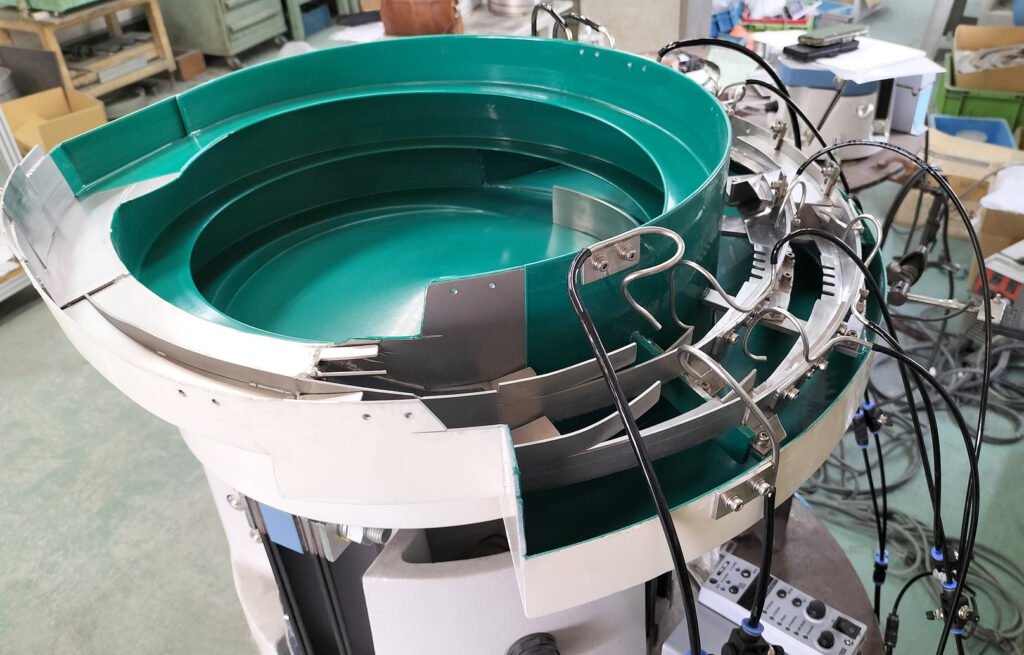 スプレー缶ノズルヘッド整列機