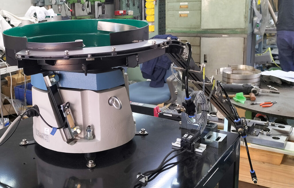 リング状金属部品整列機